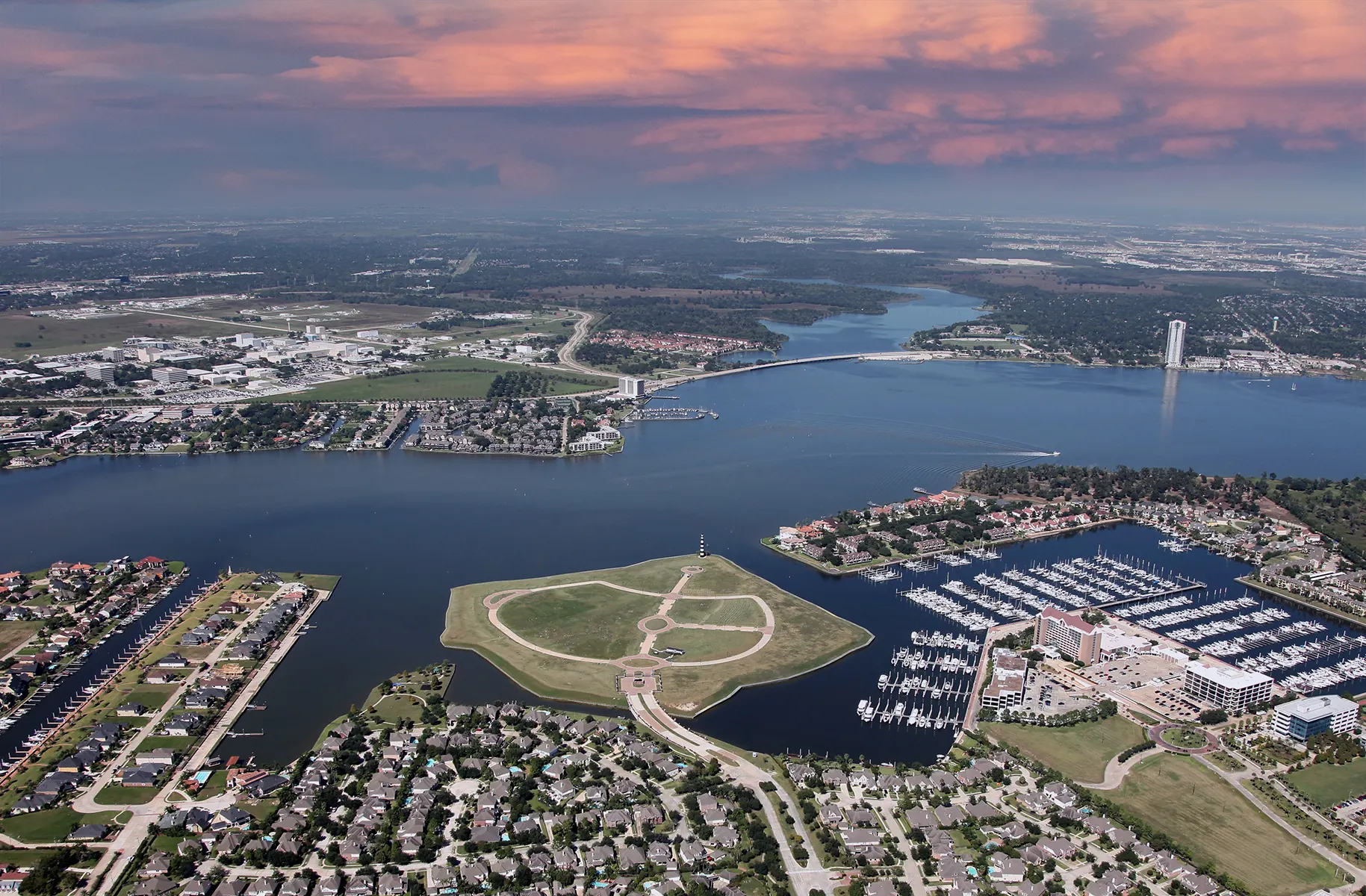 Aerial view of Clear Lake and the League City shoreline with marina, lighthouse park and NASA Parkway bridge, Texas